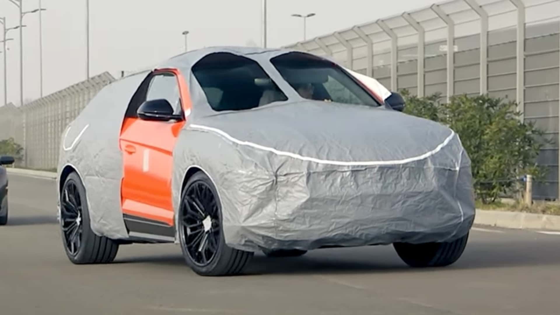 This Lamborghini Urus Prototype Is Wearing The Weirdest Camouflage We've Ever Seen